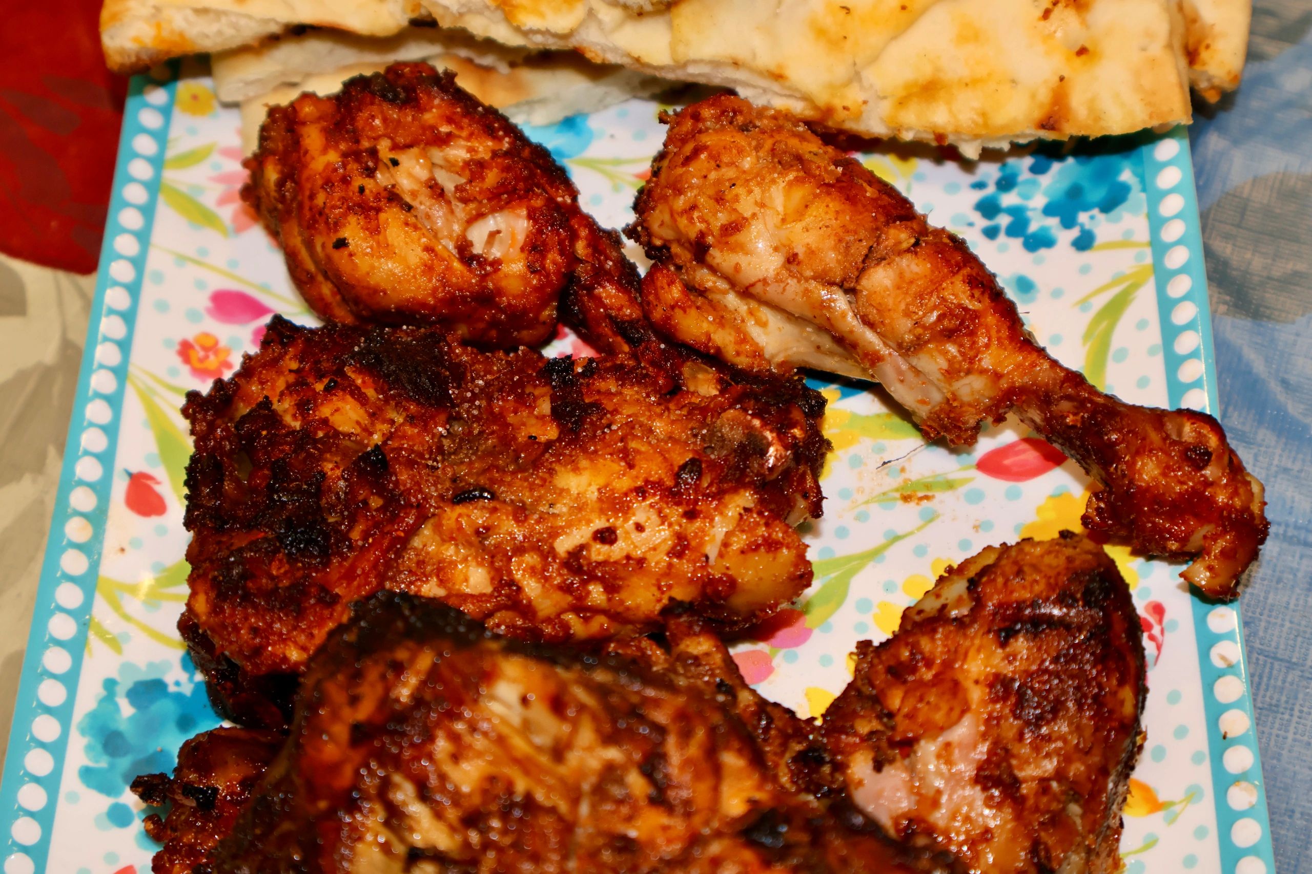 Grilled chicken barbecue pieces with naan