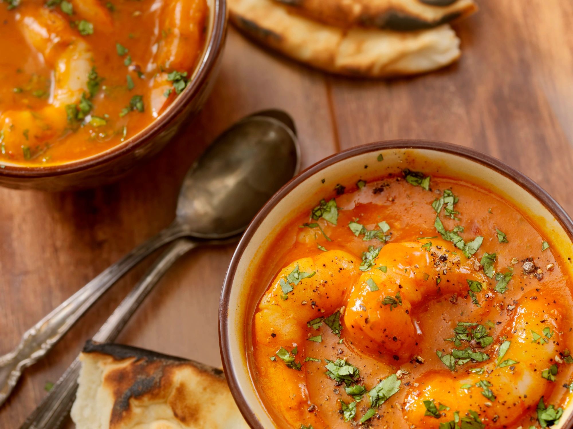 Curry served with naan bread, photographed close up
